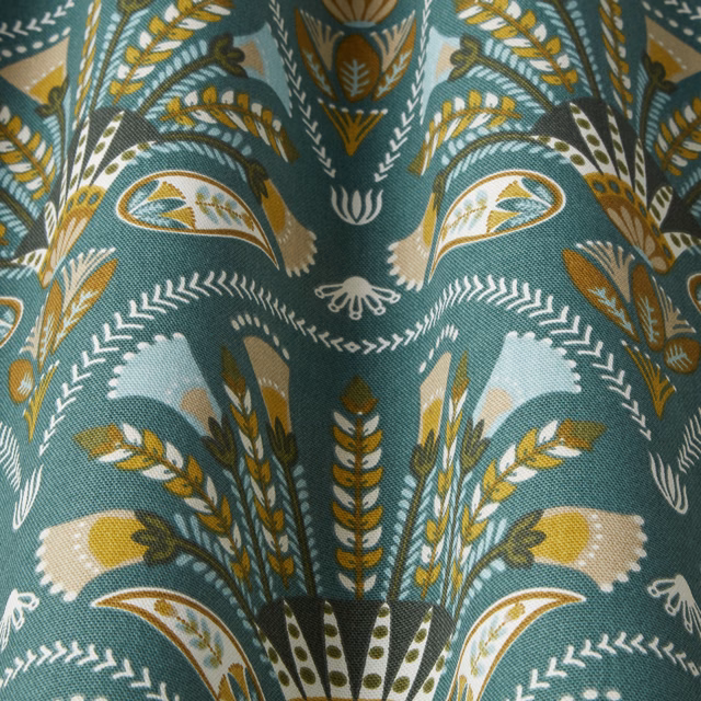 Teal green botanical fabric swatch with ochre, ivory and olive leaf motifs