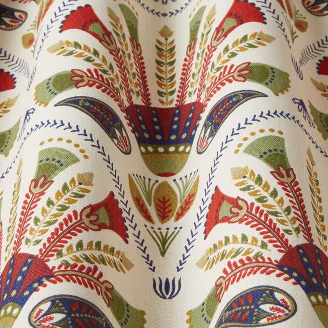 Cream fabric swatch with bold olive, red and navy botanical motifs