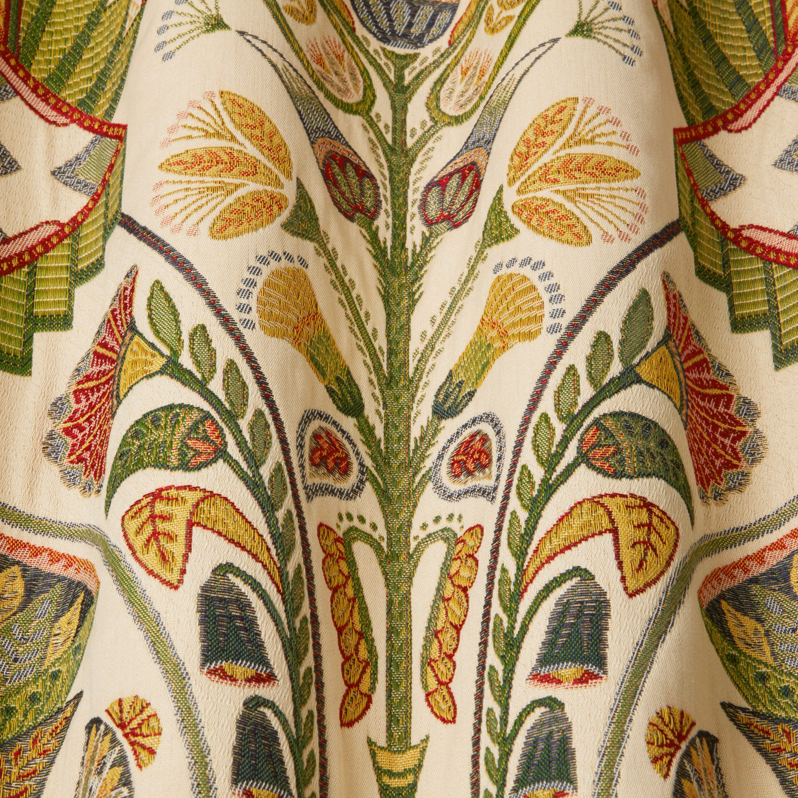 Cream fabric swatch with large embroidered botanical pattern in olive, green, red and yellow