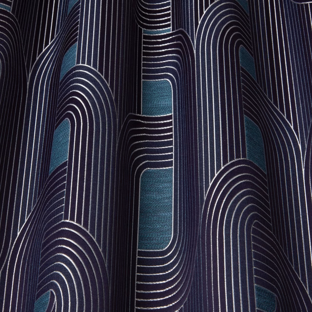 Dark navy fabric with teal arch motifs and fine ivory vertical stripes