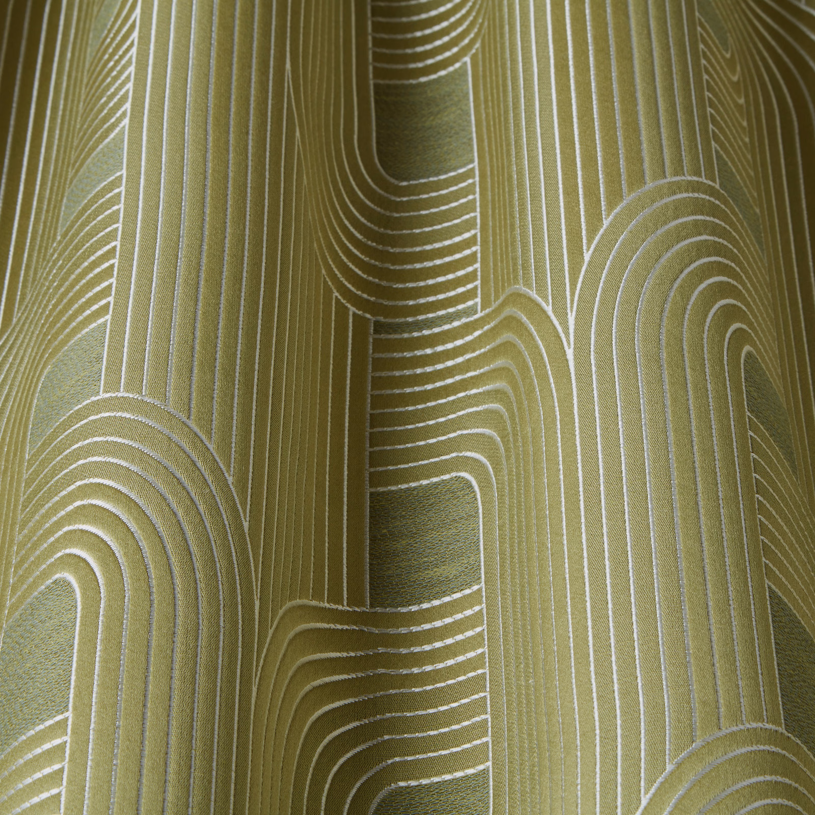 Olive green woven fabric with ivory wavy geometric line pattern and vertical stripes