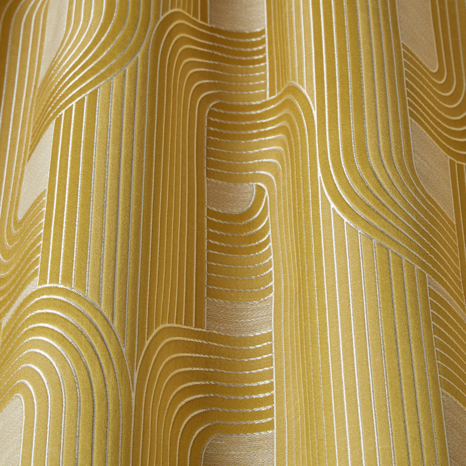 Topaz yellow woven fabric with ivory wavy stripes and arcs