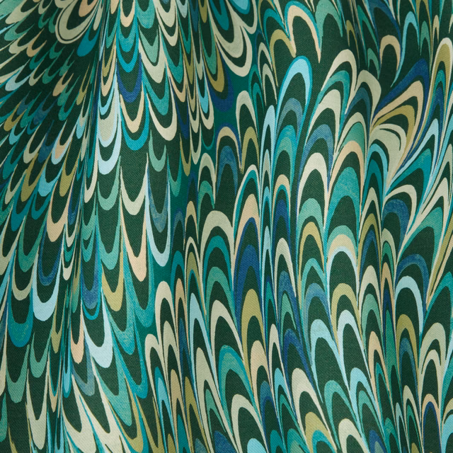 Emerald green wavy patterned fabric swatch with aqua, cream and navy accents