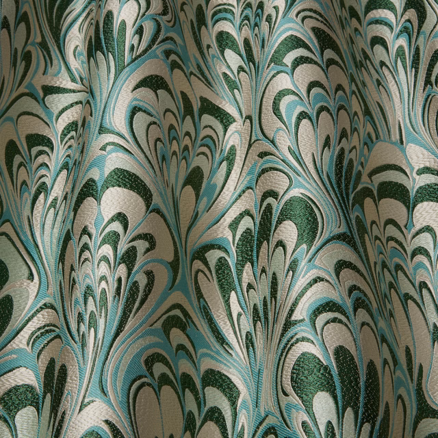 Emerald and aqua abstract feathered fabric on a pale ivory ground