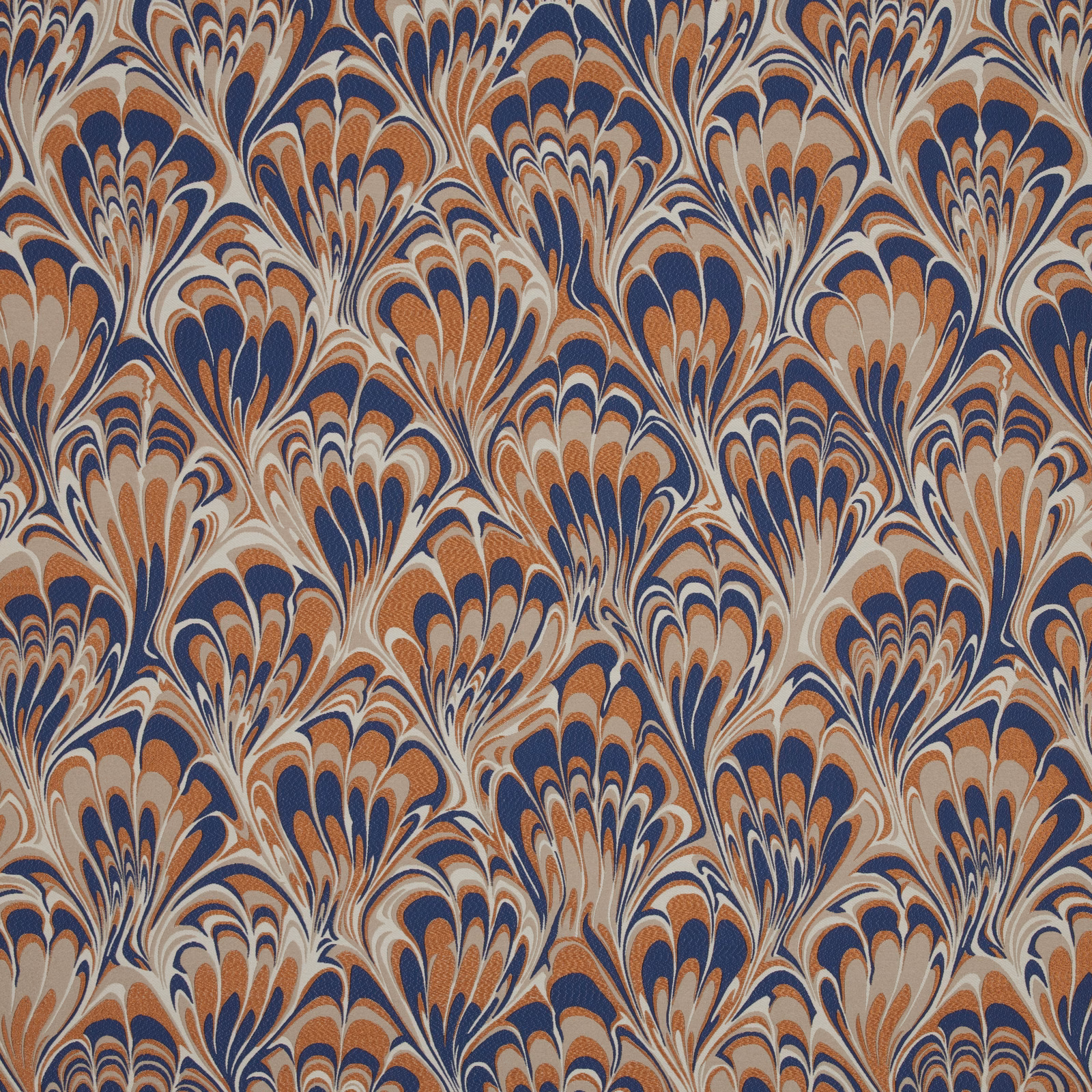 Large feathered floral fabric in navy, terracotta and cream on a pale ground