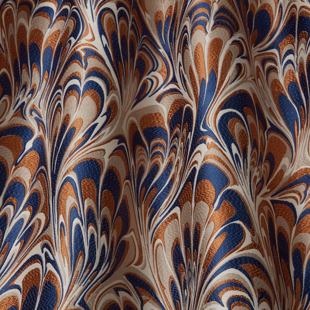 Close-up of swirling navy, copper and ivory abstract woven fabric