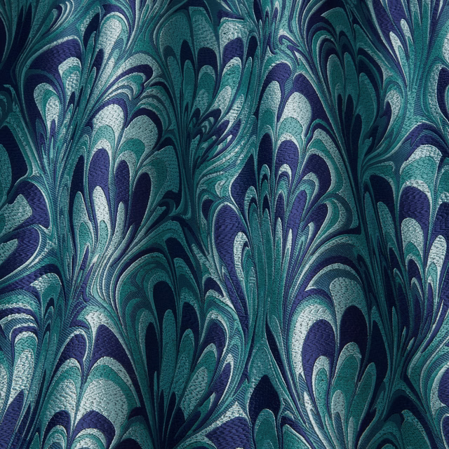 Teal, sapphire and pale aqua abstract plume-pattern fabric with a woven texture