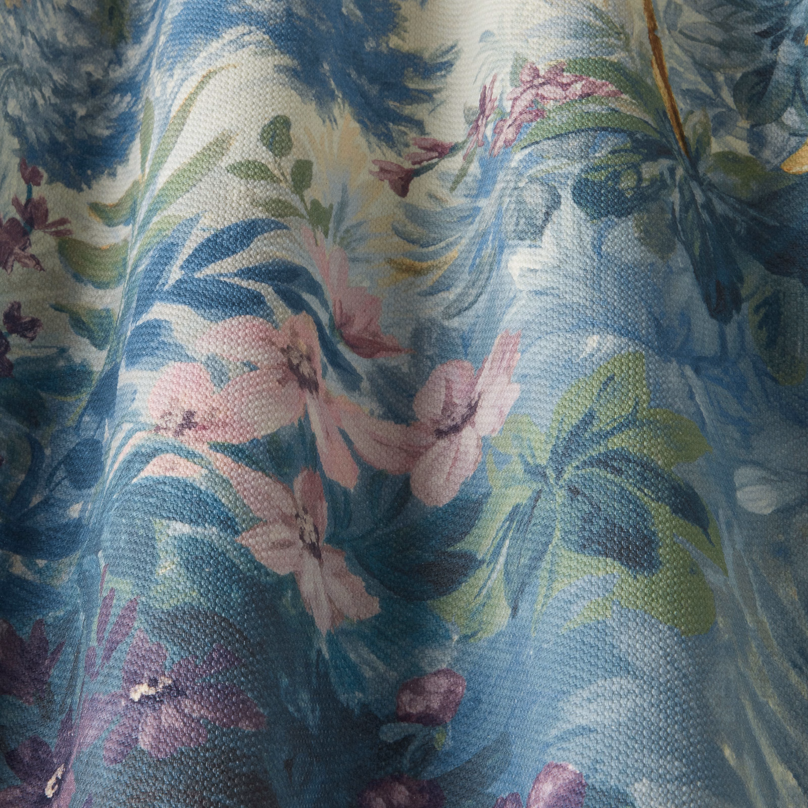 Cornflower blue cotton fabric with painterly floral and leaf print