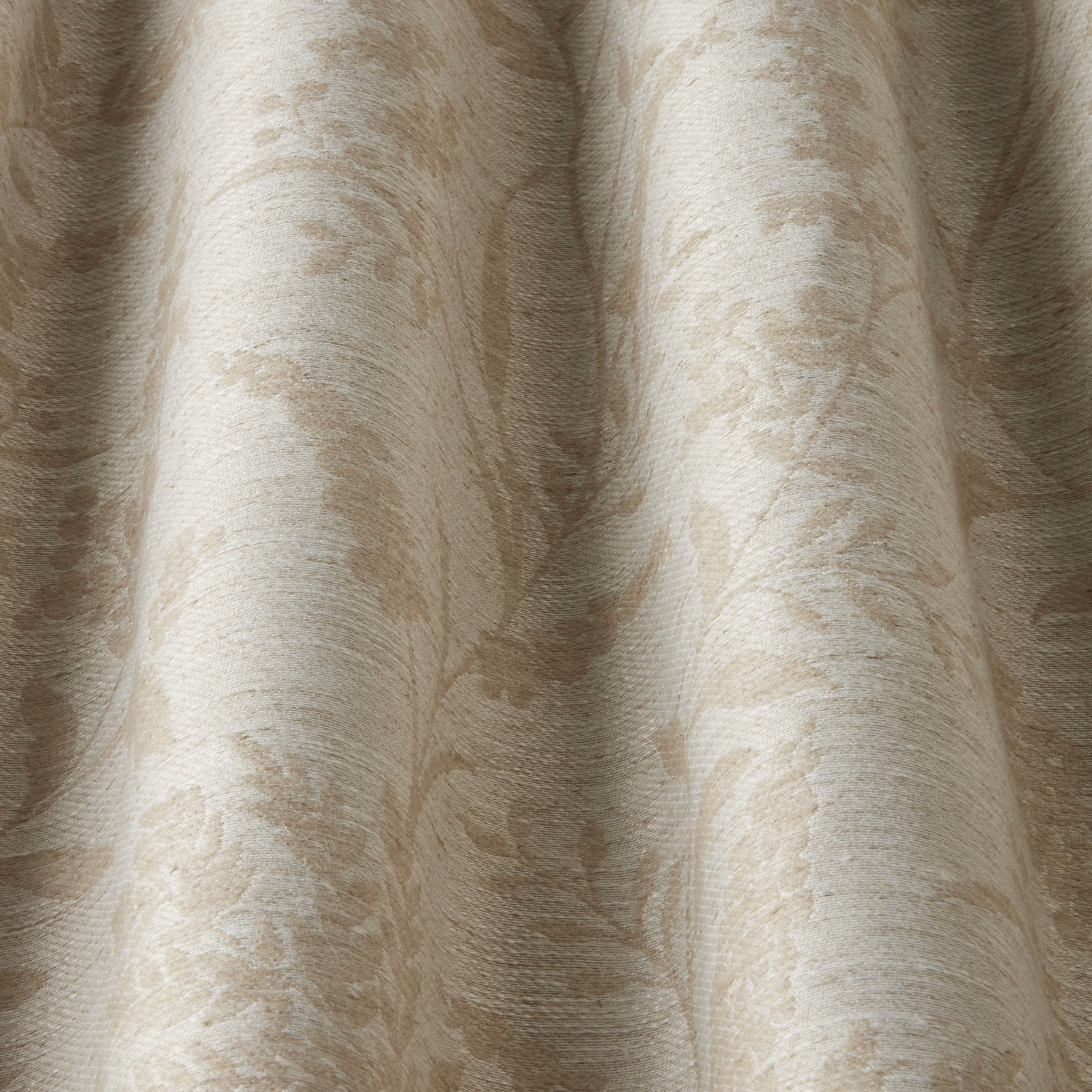 Close-up of cream cotton fabric with soft wavy tonal pattern and subtle texture