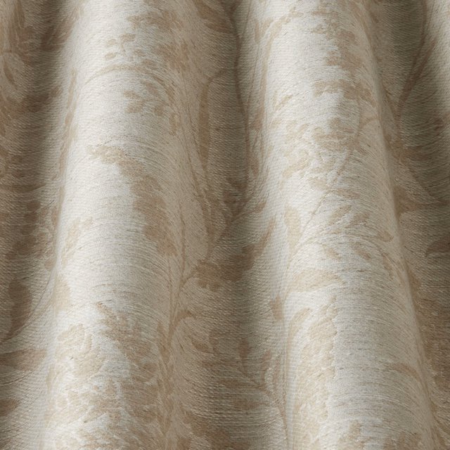 Close-up of cream cotton fabric with soft wavy tonal pattern and subtle texture