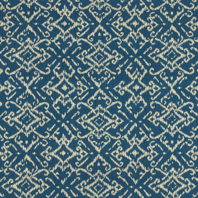 Blue cotton fabric with an ivory geometric lattice and scrolling pattern