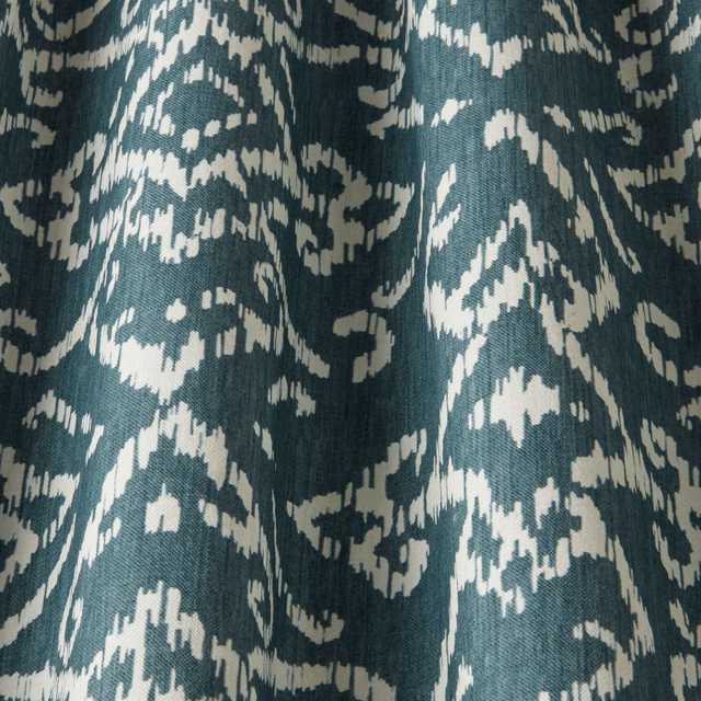 Teal cotton fabric with ivory abstract lattice motif and textured woven surface