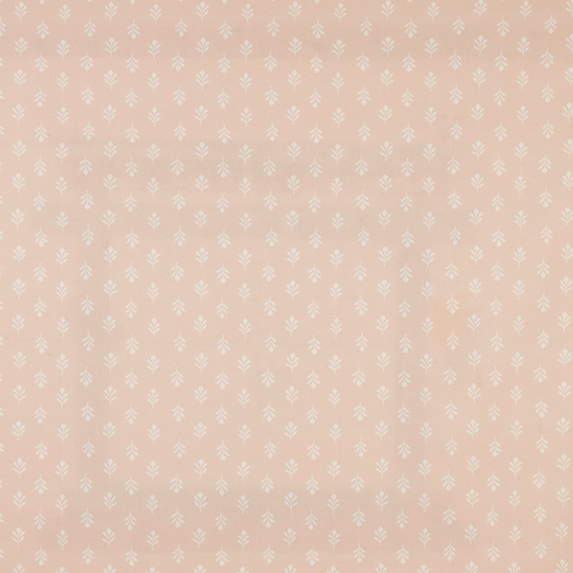 Blush pink cotton fabric with small ivory leaf motif and neat all-over repeat