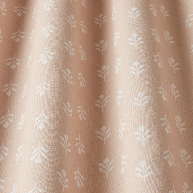 Blush pink cotton fabric with small white botanical leaf print
