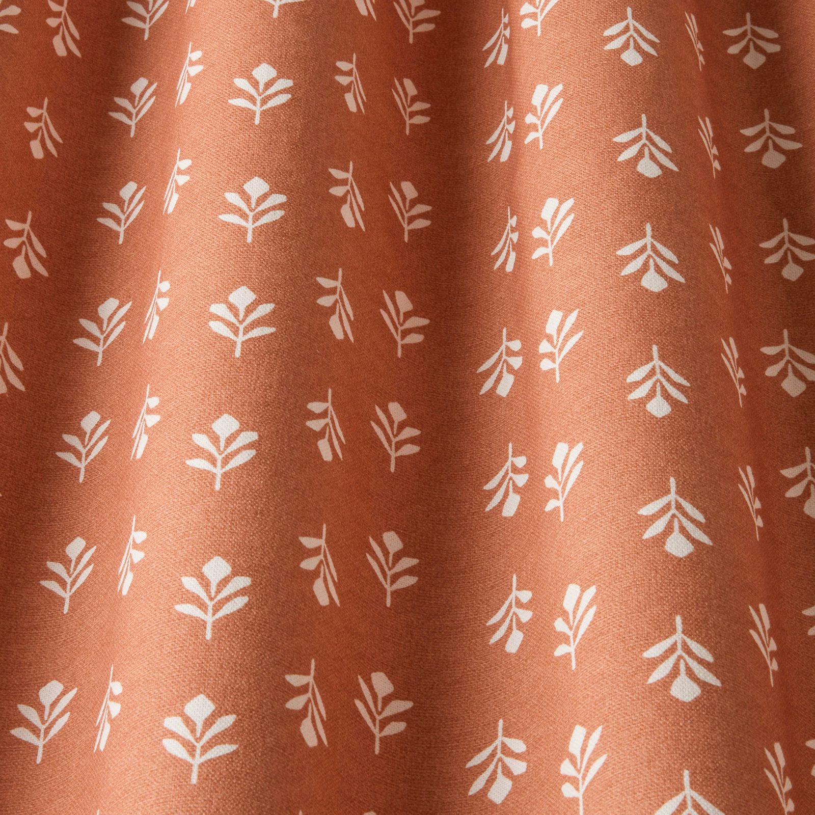 Terracotta cotton fabric with small cream bud leaf chintz pattern