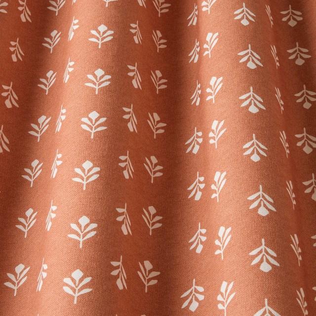 Terracotta cotton fabric with small cream bud leaf chintz pattern
