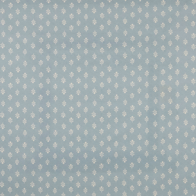 Pale sky blue cotton fabric with tiny ivory bud motif repeat