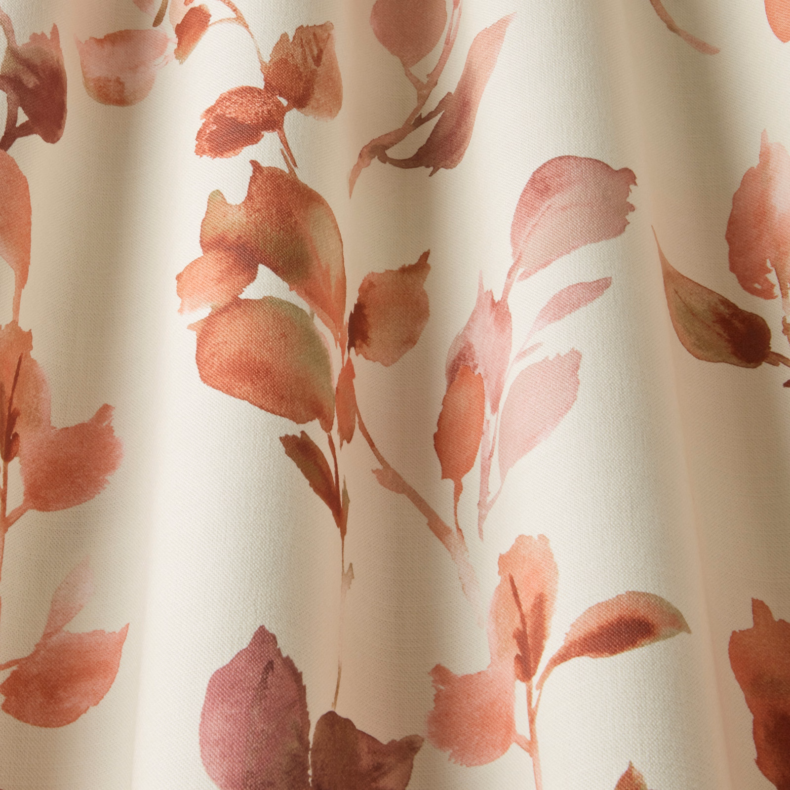 Cream cotton fabric with painterly terracotta and blush leaf print