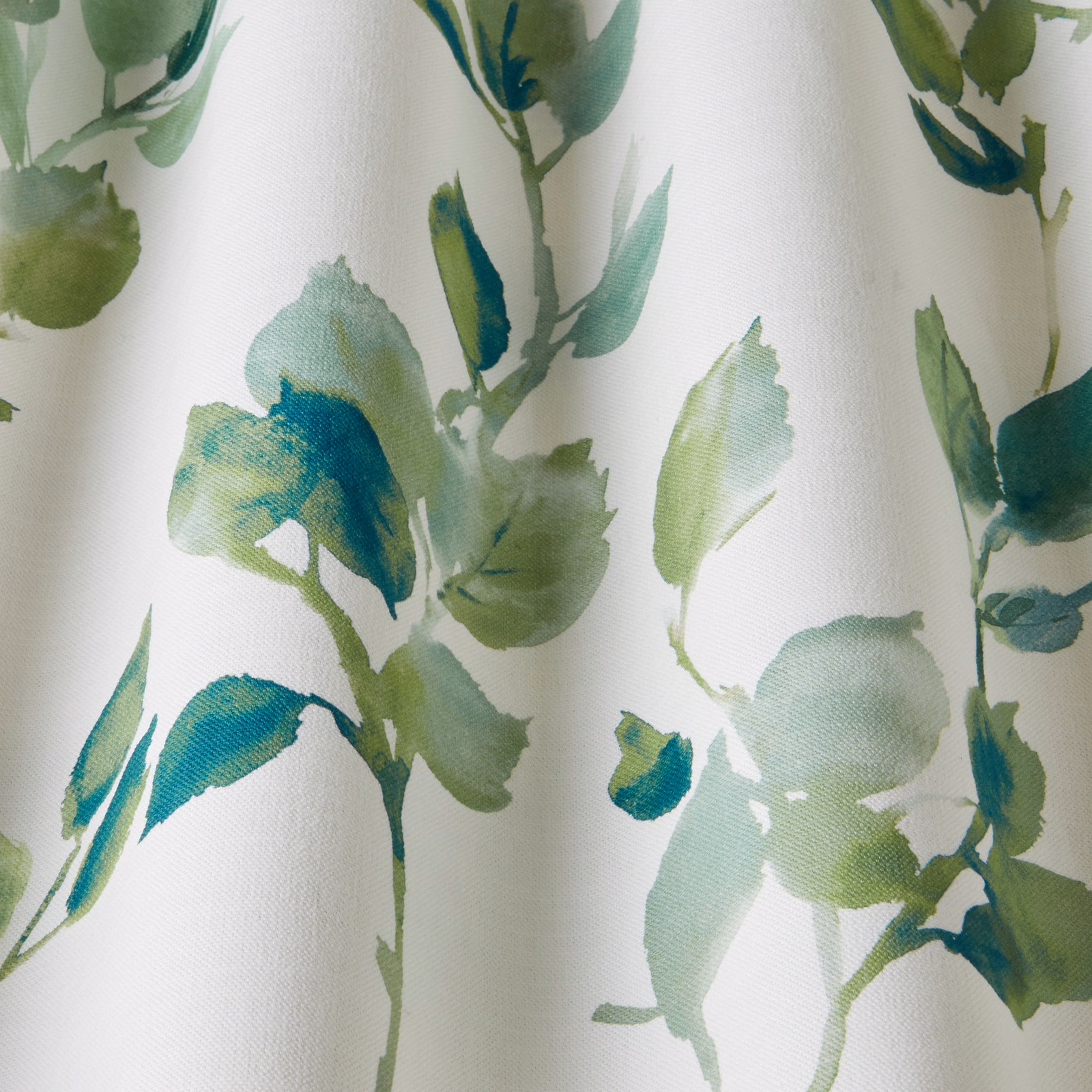 Cream cotton fabric with painterly sage and teal wavy leaf motifs