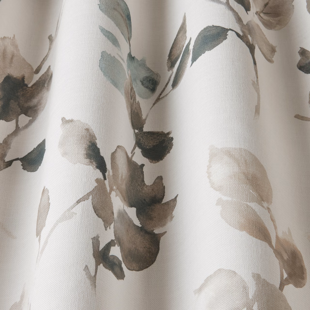 Painterly botanical cotton fabric with soft sky-blue, taupe and grey leaves on a cream ground
