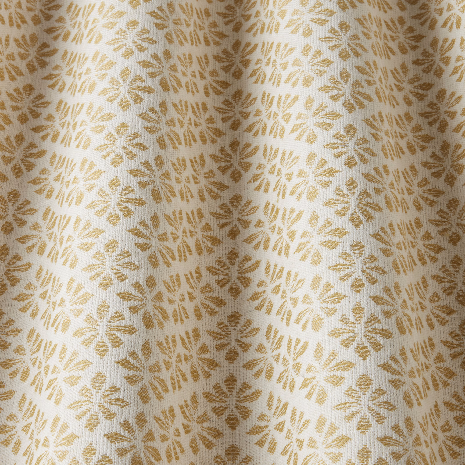 Cream cotton fabric with repeating barley-gold leaf motifs and a subtle woven texture