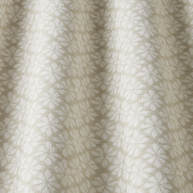 Pale cream cotton fabric with small sage leaf motif and subtle woven texture