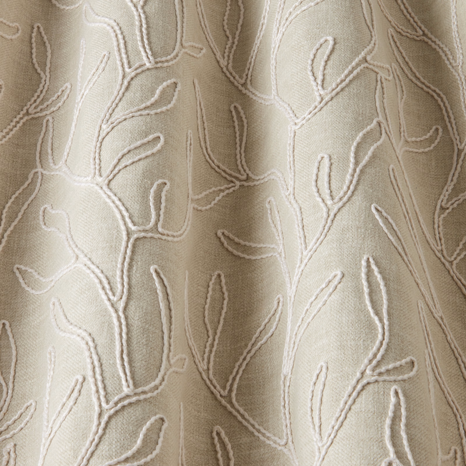 Cream cotton fabric with raised twig motif in a soft organic repeat