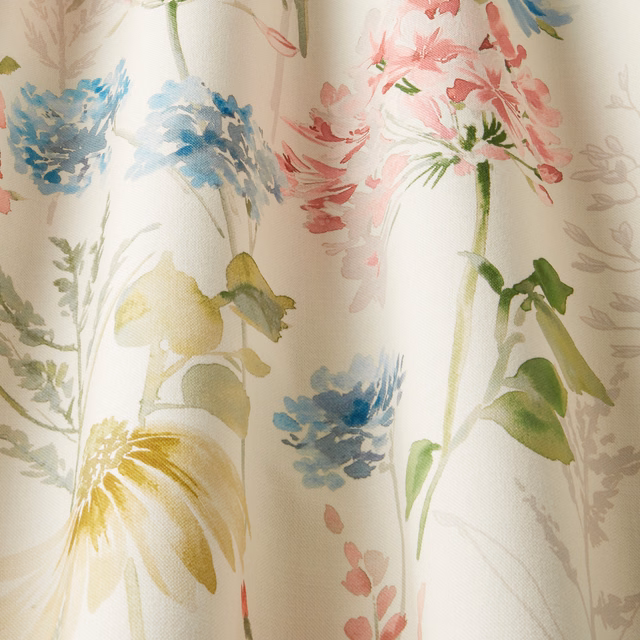 Cream cotton chintz with painterly blue, pink, green and yellow flowers