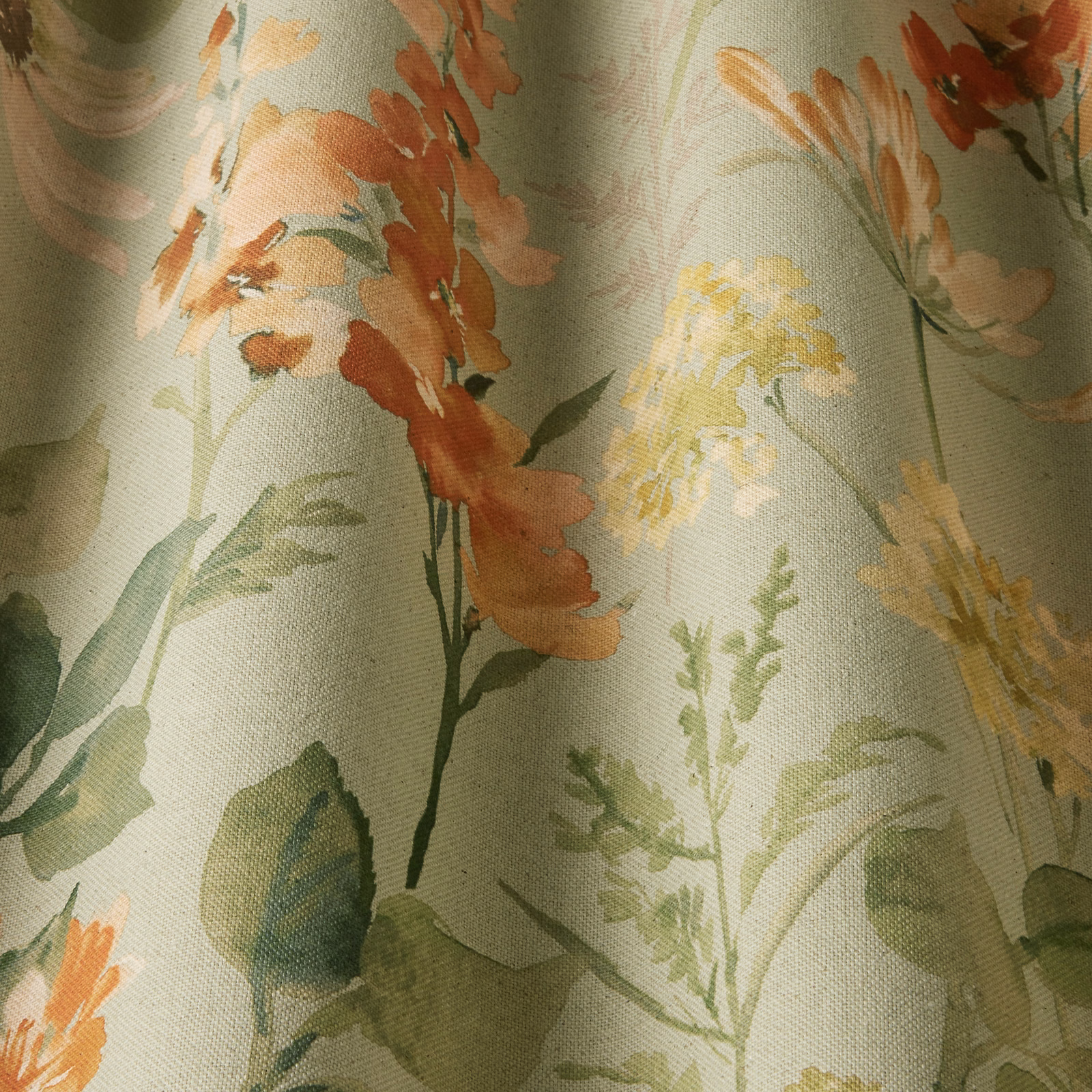 Sage green floral cotton fabric with peach and yellow painterly blooms