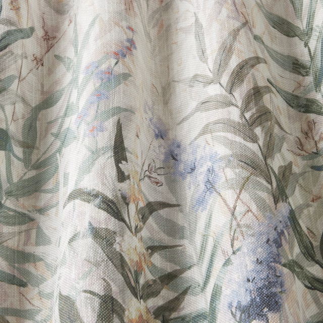 Painterly mint green floral cotton with leafy stems and blue blossoms