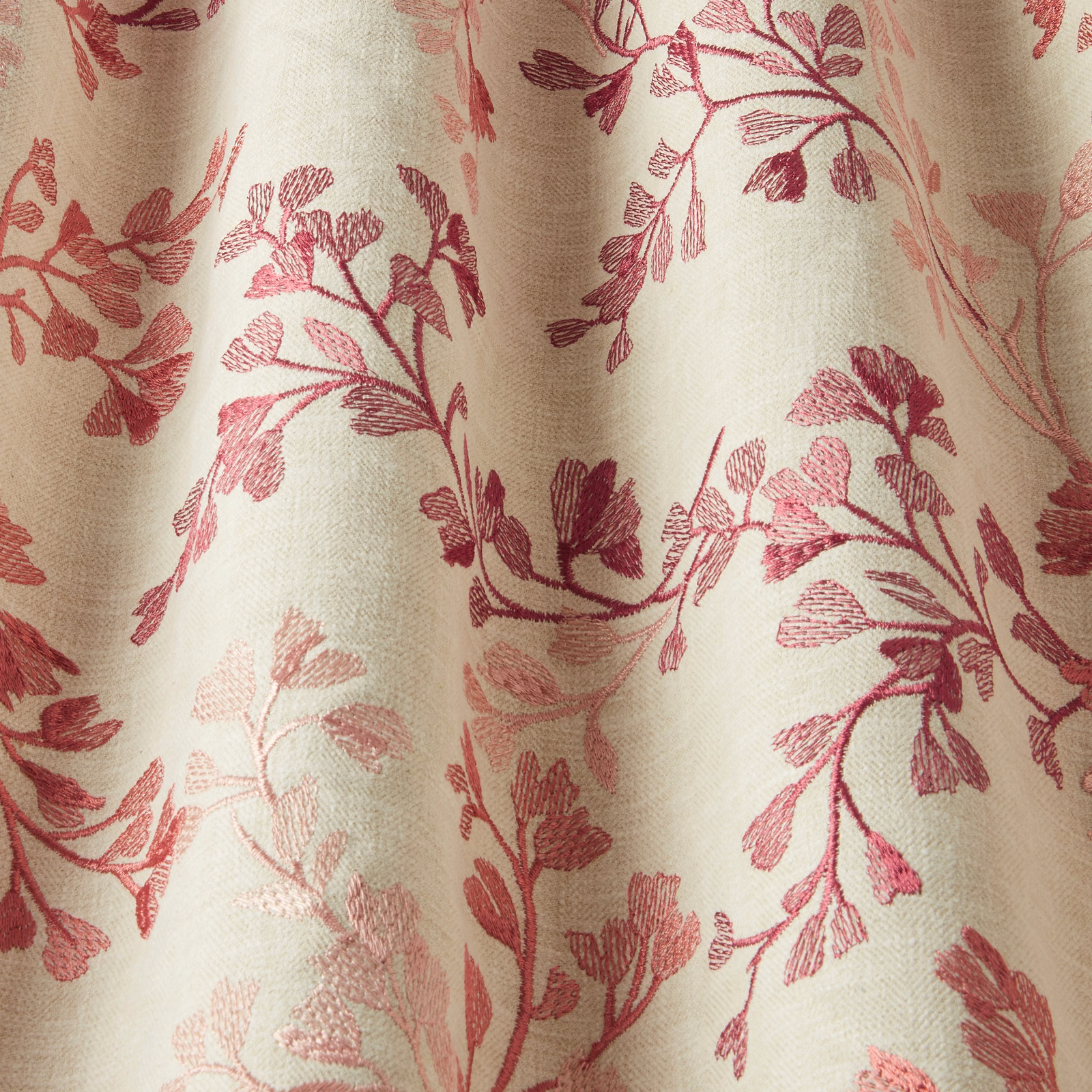 Cream cotton fabric with winding rose-pink botanical chintz print