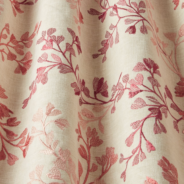 Cream cotton fabric with winding rose-pink botanical chintz print