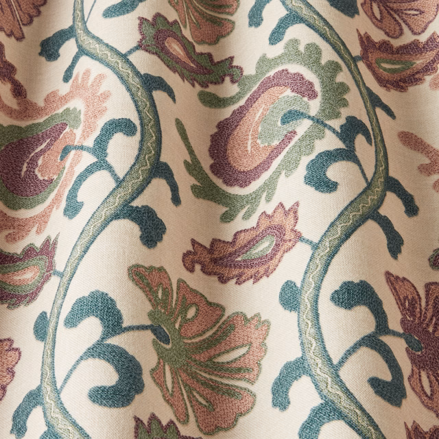 Blush cream printed fabric with wavy teal vines and plum floral motifs