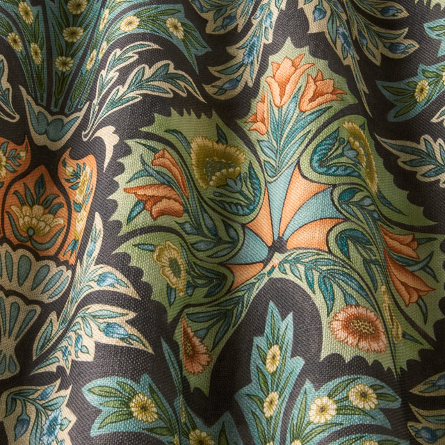 Charcoal woven floral fabric with teal, sage and coral leaves