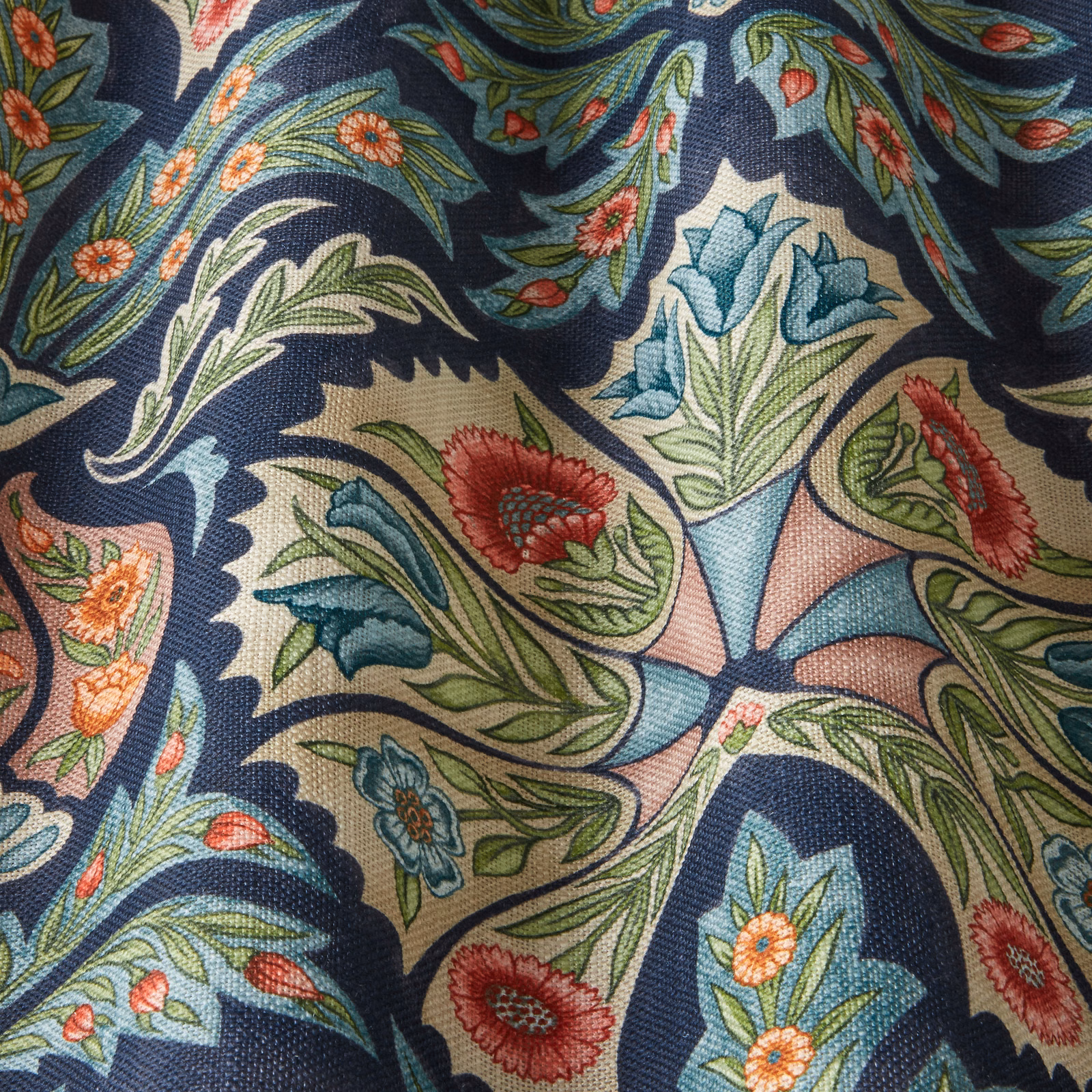 Dark navy floral fabric with scrolling leaves and jewel-toned blooms