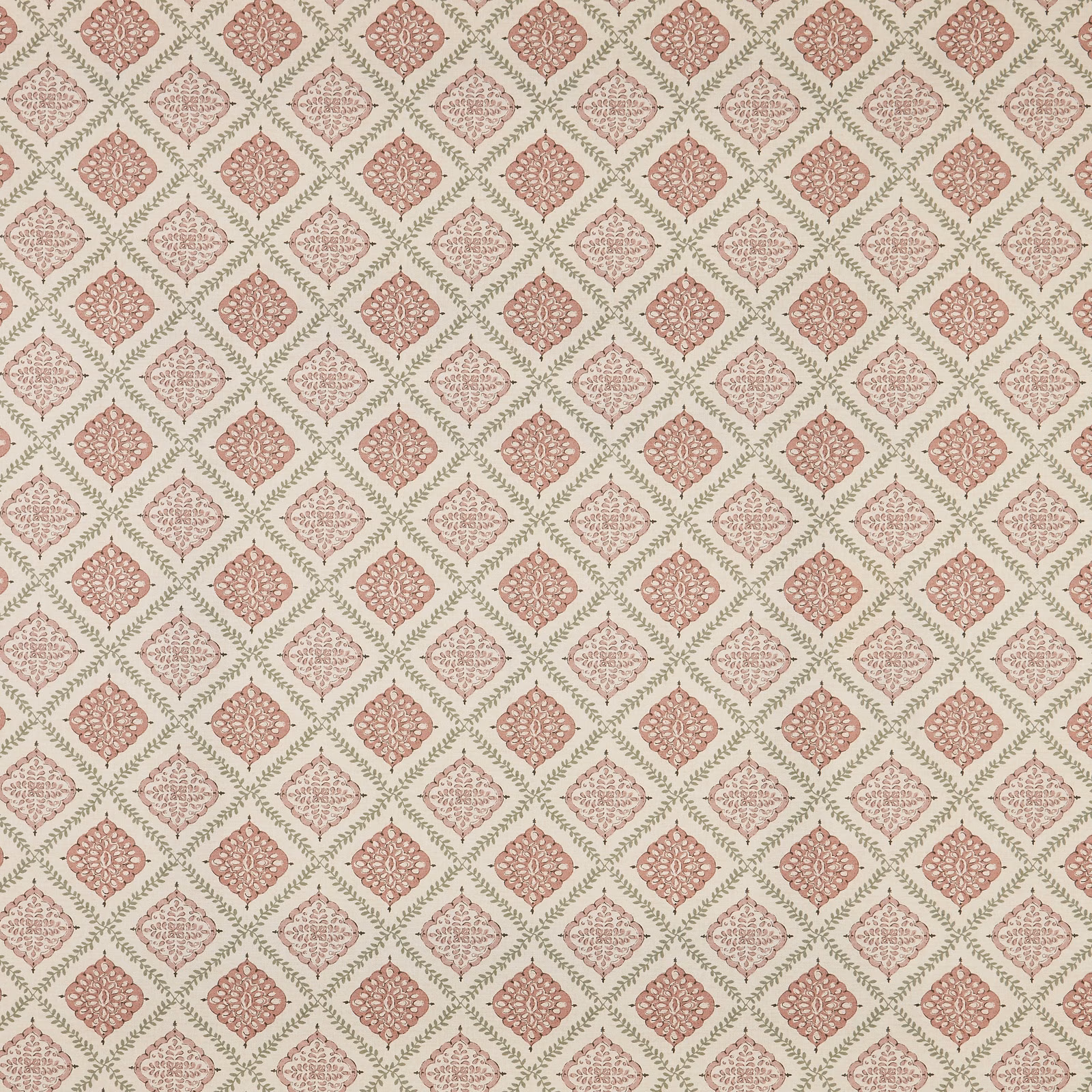 Blush pink diamond pattern fabric with small floral medallions on a pale ground