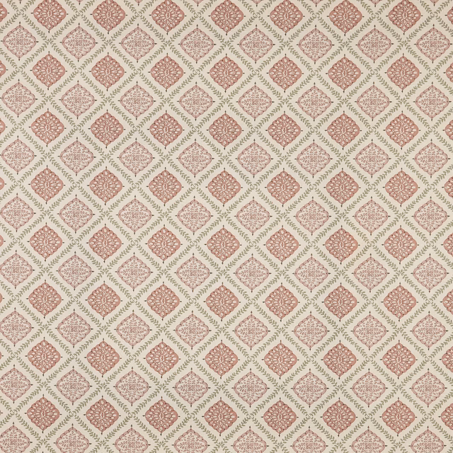 Blush pink diamond pattern fabric with small floral medallions on a pale ground