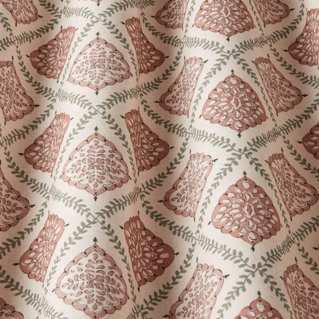 Blush pink damask motif with sage green vine links on a pale ground