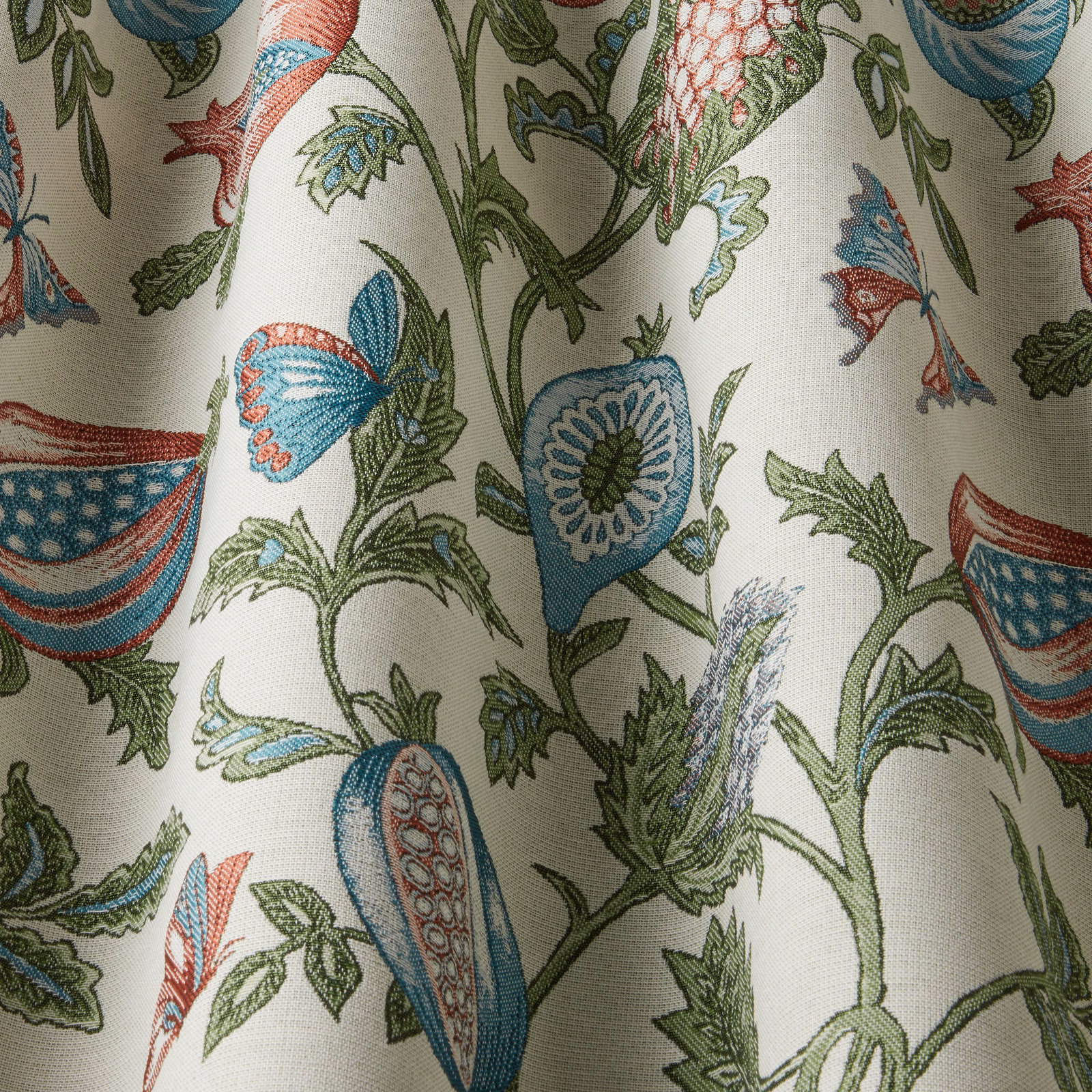 Cream botanical fabric with aqua, green and coral wavy floral motif