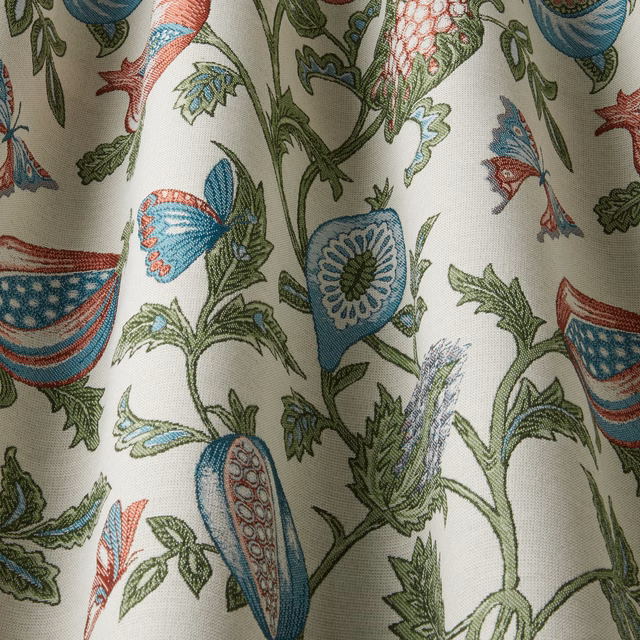 Cream botanical fabric with aqua, green and coral wavy floral motif