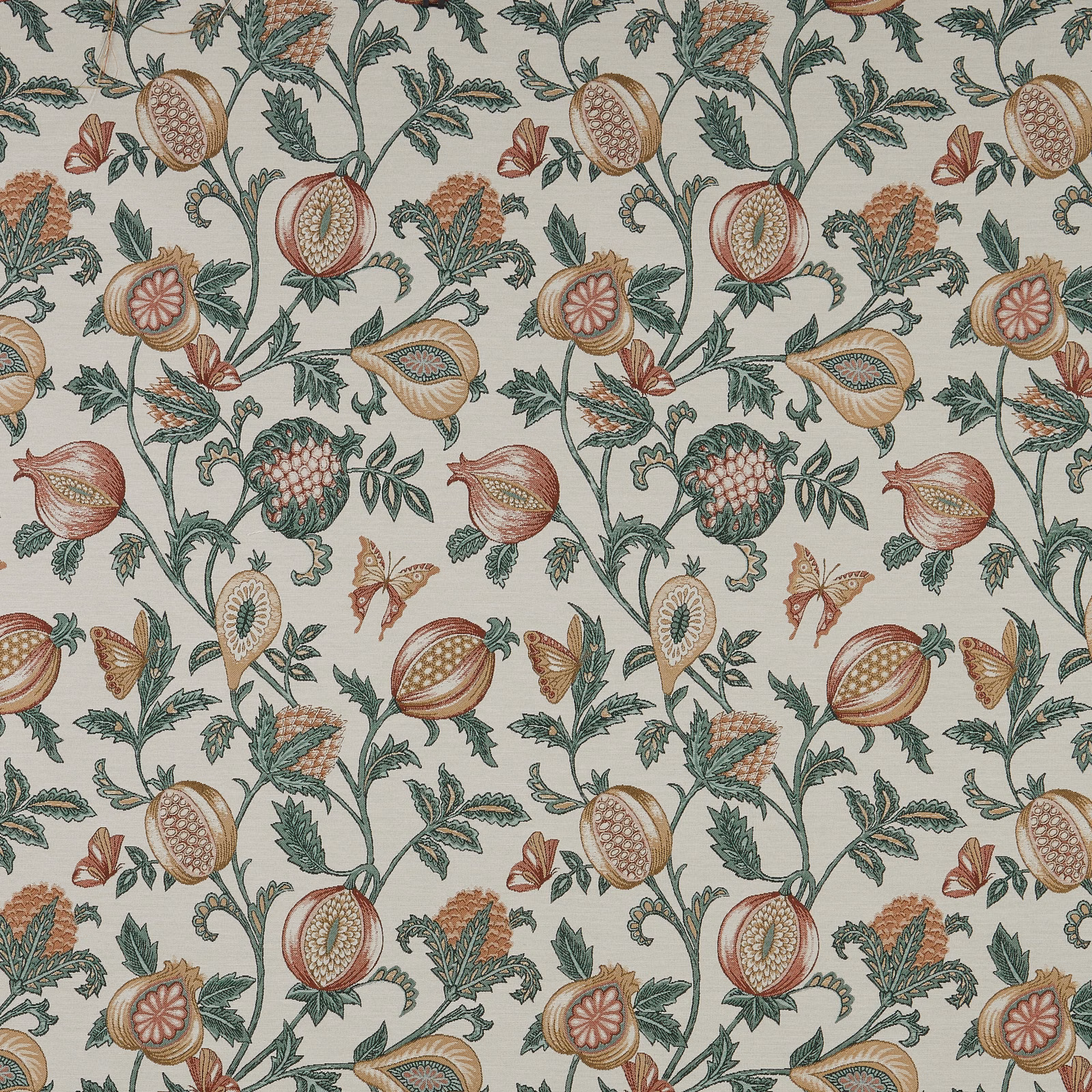 Botanical fabric with papaya fruit motifs, muted green vines and a pale ground