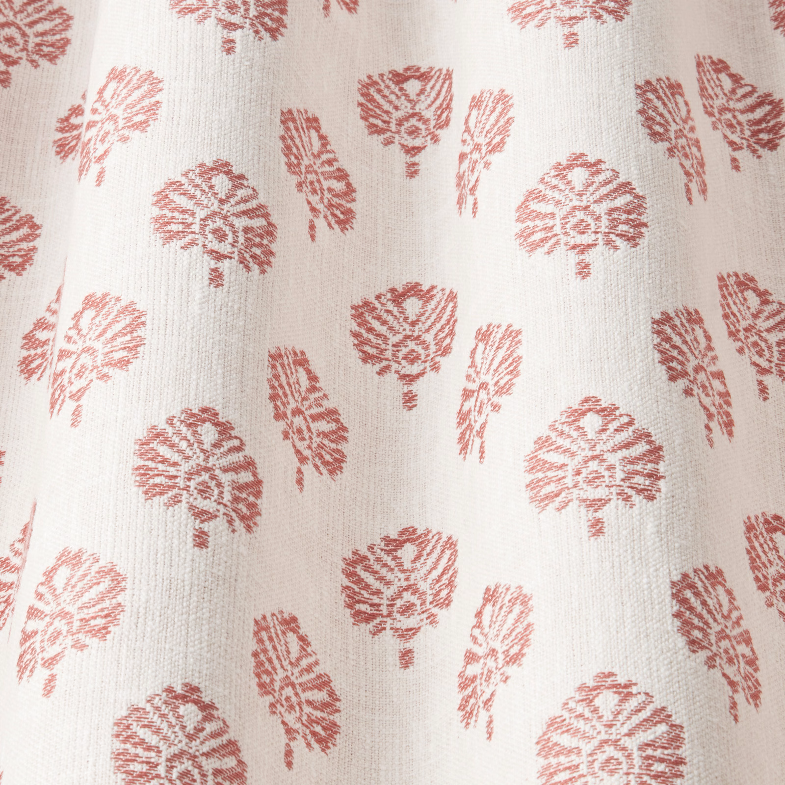 Off-white fabric with repeating dark coral wavy leaf motif