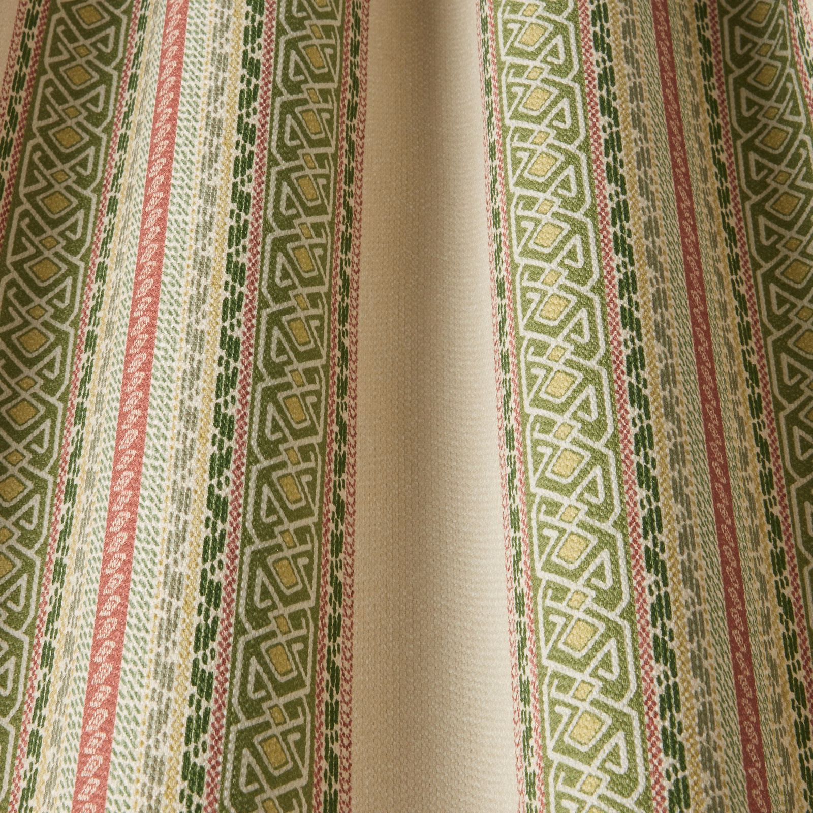 Sage green and cream striped fabric with wavy geometric bands and pink accents