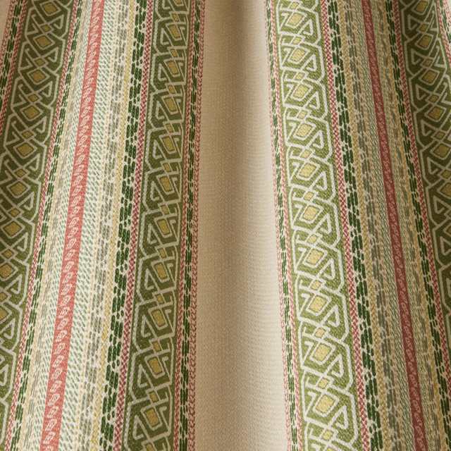 Sage green and cream striped fabric with wavy geometric bands and pink accents