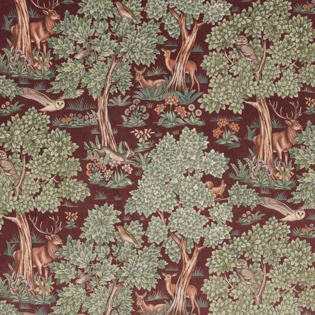 Woodland animal print fabric with burgundy ground, pale green trees and deer