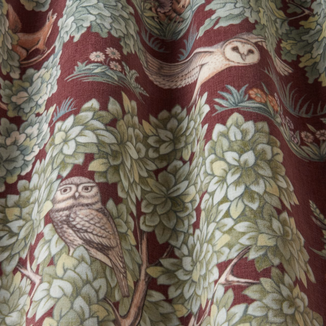 Bordeaux woven fabric with owls and leafy botanical repeat