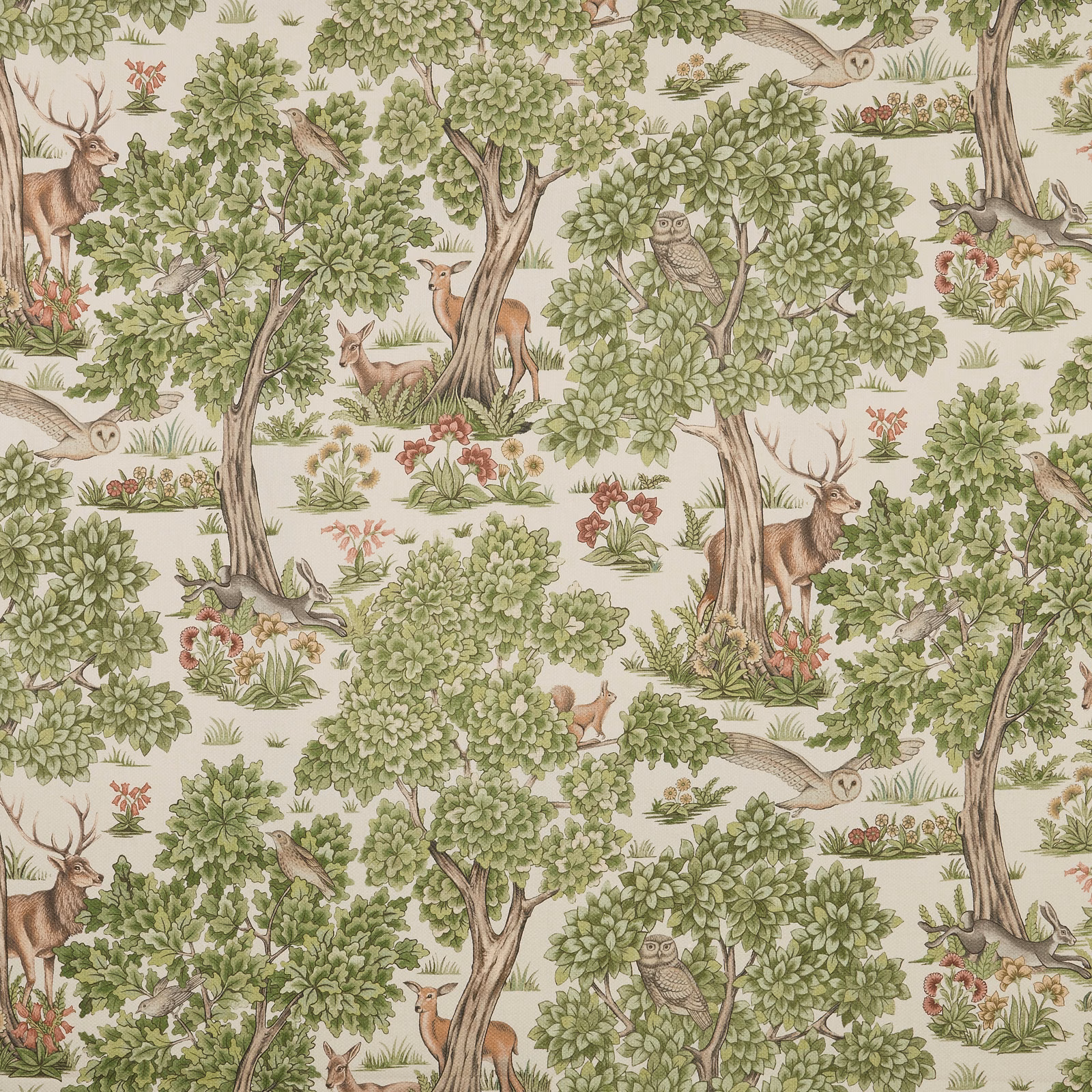 Sage woodland print with deer, owls and leafy trees on a pale ground