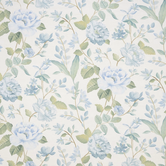 Pale blue embroidered floral fabric with sage leaves on ivory ground
