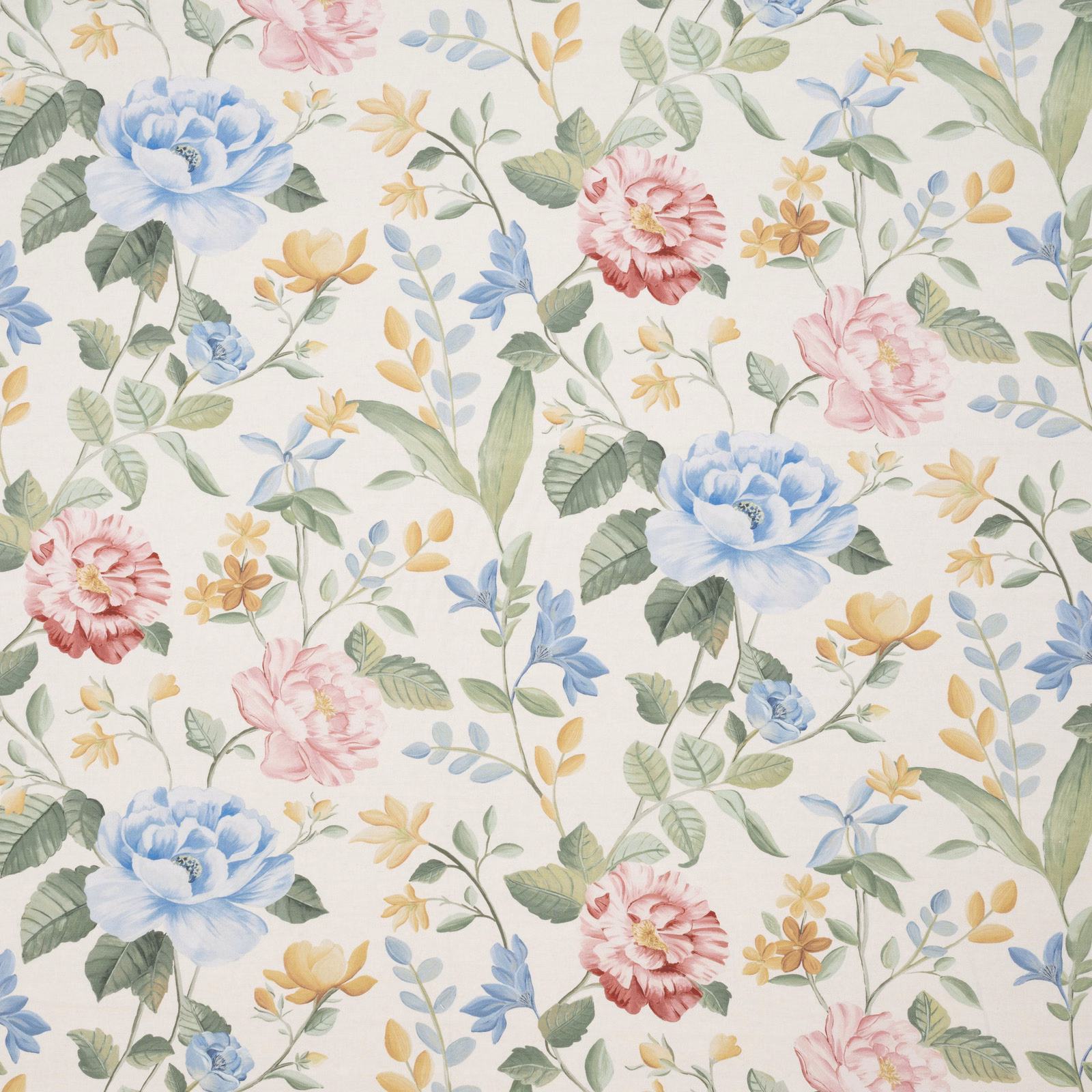 Pastel embroidered floral fabric with blue, pink and yellow blooms on ivory