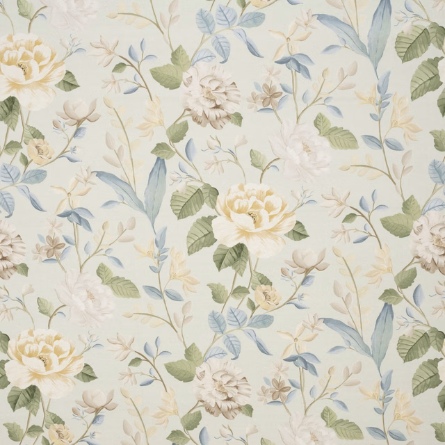 Cream floral embroidered fabric with soft green and blue leaves